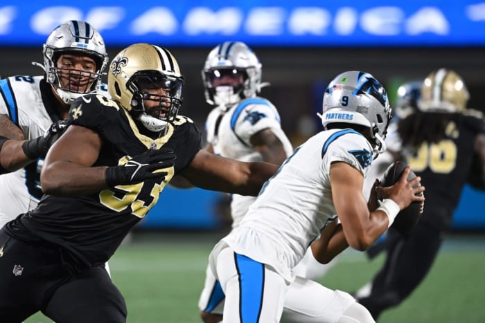 Carolina Panthers quarterback Bryce Young (9) is pressured by New Orleans Saints defensive tackle Nathan Shepherd (93). Mandatory Credit: Bob Donnan-USA TODAY Sports
